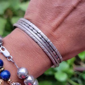Awesome four textured silver bangle set stack